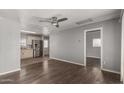 Open-concept living room showcasing modern ceiling fan, hardwood floors and neutral paint at 4205 N 3Rd Ave, Phoenix, AZ 85013