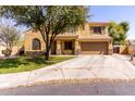 Inviting two-story home featuring a desert-landscaped front yard and a spacious two car garage at 4529 S Granite St, Gilbert, AZ 85297