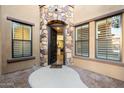 Inviting front entryway featuring a stone archway and an open door revealing a glimpse of the interior at 4777 S Fulton Ranch Blvd # 1098, Chandler, AZ 85248