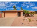 Charming single-story home featuring a desert landscape and a welcoming entrance with rock decorations at 6208 W Willow Ave, Glendale, AZ 85304