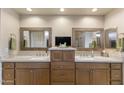 Spacious bathroom featuring dual vanities, framed mirrors, and ample cabinet storage at 6998 E Soaring Eagle Way, Scottsdale, AZ 85266