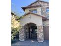 Close-up of front porch showing stone supports and gated front entrance at 7253 E Nathan St, Mesa, AZ 85207