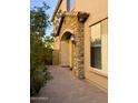 Front entrance with brick paved walkway and stone pillars at 7253 E Nathan St, Mesa, AZ 85207