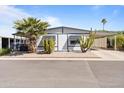 Charming home with well-kept landscaping, mature cacti, and carport at 8103 E Southern Ave # 25, Mesa, AZ 85209