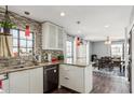 Charming kitchen with modern mosaic backsplash, stainless appliances and view to dining room at 8231 N 21St Dr # E101, Phoenix, AZ 85021