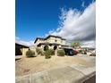 Charming two-story home with well-maintained desert landscaping and covered porch at 8420 S 40Th Dr, Laveen, AZ 85339