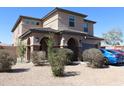 Well-maintained home with a neutral color scheme, tile roof and manicured landscaping at 8420 S 40Th Dr, Laveen, AZ 85339