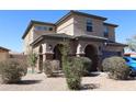 Well-maintained home with a neutral color scheme, tile roof and manicured landscaping at 8420 S 40Th Dr, Laveen, AZ 85339