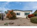 A charming single-story home showcasing easy-care landscaping and a freshly painted exterior at 9340 E Sun Lakes S Blvd, Sun Lakes, AZ 85248