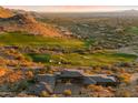 Expansive luxury home with desert landscaping and golf course views, set against a mountain backdrop at 9820 E Thompson Peak Pkwy # 629, Scottsdale, AZ 85255