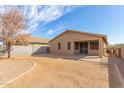 Expansive backyard with gravel, patio area, block wall and privacy fence at 1380 W Angus Rd, San Tan Valley, AZ 85143