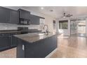 Modern kitchen featuring an island, granite counters, stainless steel appliances, and an open layout at 1380 W Angus Rd, San Tan Valley, AZ 85143