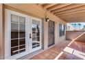 Cozy outdoor patio features tile flooring, exposed beam ceiling, and natural light at 14644 N Yerba Buena Way # C, Fountain Hills, AZ 85268