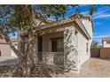 Charming covered porch with shade tree at 17254 W Marshall Ln, Surprise, AZ 85388