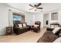 Bright living room with neutral walls, natural light, and comfortable seating at 1926 E Clarendon Ave, Phoenix, AZ 85016