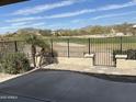 Enjoy golf course views from the backyard's patio and landscaped surroundings at 22988 W Twilight Trl, Buckeye, AZ 85326
