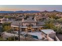 Expansive backyard with pool and patio, capturing the tranquil desert lifestyle at 27914 N 100Th Pl, Scottsdale, AZ 85262