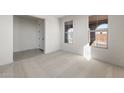 Bright bedroom with carpet flooring, dual windows, neutral walls and white trim at 31672 N 135Th Ln, Peoria, AZ 85383