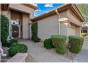 Charming home showcasing lush greenery and a well-maintained entrance with a decorative security door at 4503 E Robin Ln, Phoenix, AZ 85050