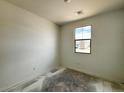 Well-lit bedroom with a large window offering scenic views and ample natural light at 47747 W Kenner Dr, Maricopa, AZ 85139