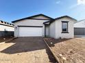 Charming single-story home featuring a two-car garage and a low-maintenance front yard at 47747 W Kenner Dr, Maricopa, AZ 85139