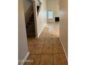 Welcoming entryway with tile flooring, neutral walls and a staircase at 8154 W Greer Ave, Peoria, AZ 85345