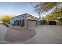 Three-car garage, additional covered parking, and gated entryway at 8155 E Juan Tabo Rd, Scottsdale, AZ 85255