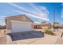 Exterior shot highlighting a single-Gathering house with a well-maintained front yard and a large garage door at 8551 E Kiowa Ave, Mesa, AZ 85209