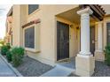 Inviting front entrance with decorative pillars and a secure gate, enhancing curb appeal and security at 921 W University Dr # 1143, Mesa, AZ 85201