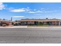 Inviting single-story home with a well-kept lawn and covered parking, situated in a peaceful and attractive community at 10801 W Mountain View Rd, Sun City, AZ 85351