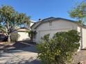 Lovely home features a well-maintained yard and convenient driveway leading to the garage at 11207 N 59Th Dr, Glendale, AZ 85304