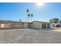 Beautiful home showcasing low-maintenance landscaping, a two-car garage, and a clean, modern design at 12235 N 36Th Dr, Phoenix, AZ 85029
