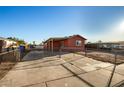 Fenced backyard with a concrete patio, perfect for outdoor activities and privacy at 1919 E Libby St, Phoenix, AZ 85022