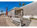 Inviting home exterior with a cozy outdoor seating area and desert landscape at 201 S Greenfield Rd # 254, Mesa, AZ 85206