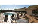 Inviting community pool featuring lounge chairs, tables, and a refreshing place to relax at 201 S Greenfield Rd # 254, Mesa, AZ 85206