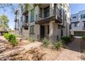 Attractive two-story townhome showcases a private balcony, manicured landscaping, and a welcoming facade at 2090 S Dorsey Ln # 1020, Tempe, AZ 85282