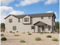 Exterior elevation showcasing a charming two-story home with desert landscaping and a covered entryway at 26217 N 19Th Ln, Phoenix, AZ 85085