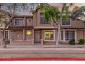 Inviting two-story townhome featuring a red tile roof and decorative round windows at 2875 W Highland St # 1102, Chandler, AZ 85224