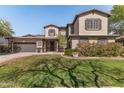 Well-maintained two-story home with a green lawn and meticulously kept landscaping at 3062 E Cullumber St, Gilbert, AZ 85234