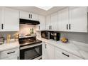 Well-equipped kitchen with white cabinets, stainless steel appliances, and sleek countertops at 4730 W Northern Ave # 1102, Glendale, AZ 85301