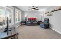 Bright living room with comfortable seating, large windows, and neutral decor at 5905 N 83Rd St, Scottsdale, AZ 85250