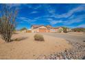 Beautiful single-story home featuring a three-car garage and native desert vegetation at 730 E Tanya Trl, Phoenix, AZ 85086