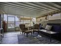 Sunroom showcasing a seating area, tile floors, and views of the backyard at 891 W Moon Shadow Dr, Casa Grande, AZ 85122