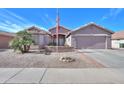 Charming single-story home with neutral stucco, desert landscaping, and a two-car garage in a quiet residential neighborhood at 123 S Lucia Ln, Casa Grande, AZ 85194