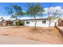 Charming single-story home featuring a minimalist landscape and bright white exterior paint at 1254 W Manhatton Dr, Tempe, AZ 85282