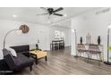 Bright living room featuring modern furnishings, hardwood floors, and white walls at 1254 W Manhatton Dr, Tempe, AZ 85282