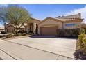 Single-story home with a tile roof, covered entrance, and spacious driveway, ideal for comfortable suburban living at 1313 W Straford Ave, Gilbert, AZ 85233