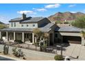 Gorgeous southwestern-style home with well-maintained landscaping and mountain views at 13662 E Shaw Butte Dr, Scottsdale, AZ 85259