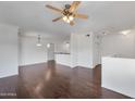 Spacious living room featuring ceiling fan, and rich hardwood flooring at 19777 N 76Th St # 2150, Scottsdale, AZ 85255