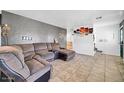 The comfortable living room features tile flooring, recessed lighting, and a textured wall at 2940 W Townley Ave, Phoenix, AZ 85051